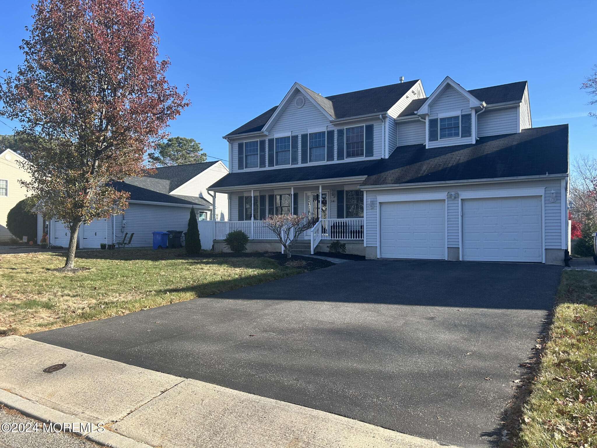 141 Marlin Road Manahawkin, NJ 08050 - Photo 2 of 33 a front view of a house with a yard and garage