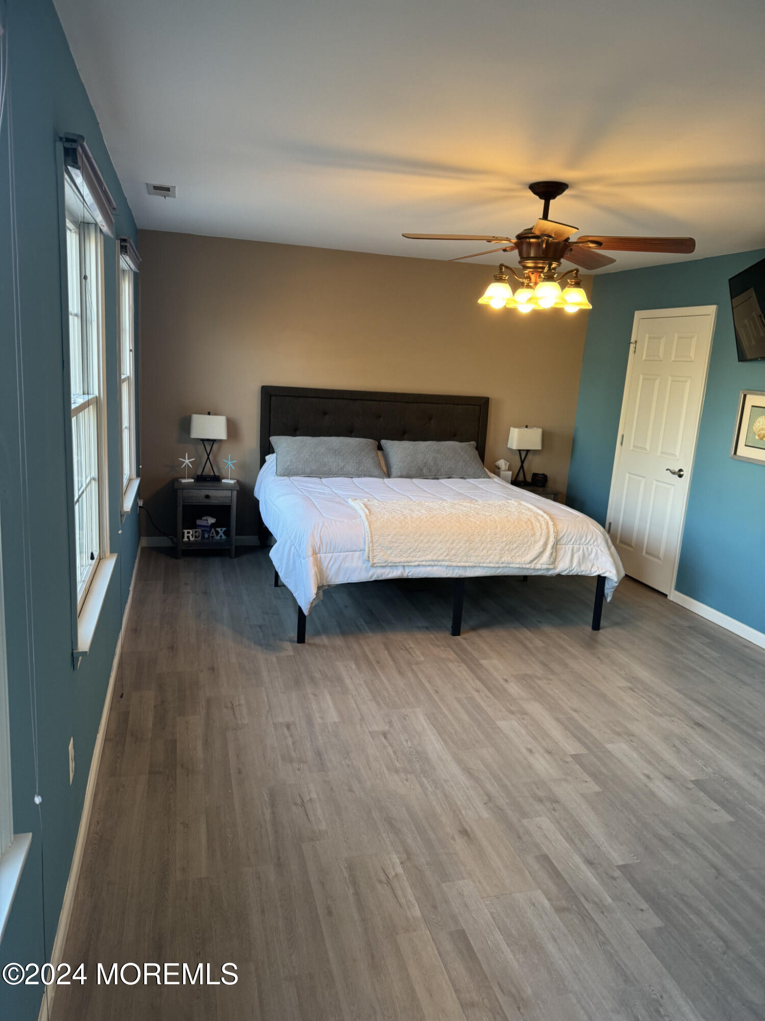 141 Marlin Road Manahawkin, NJ 08050 - Photo 21 of 33 a bedroom with a bed chandelier and a window