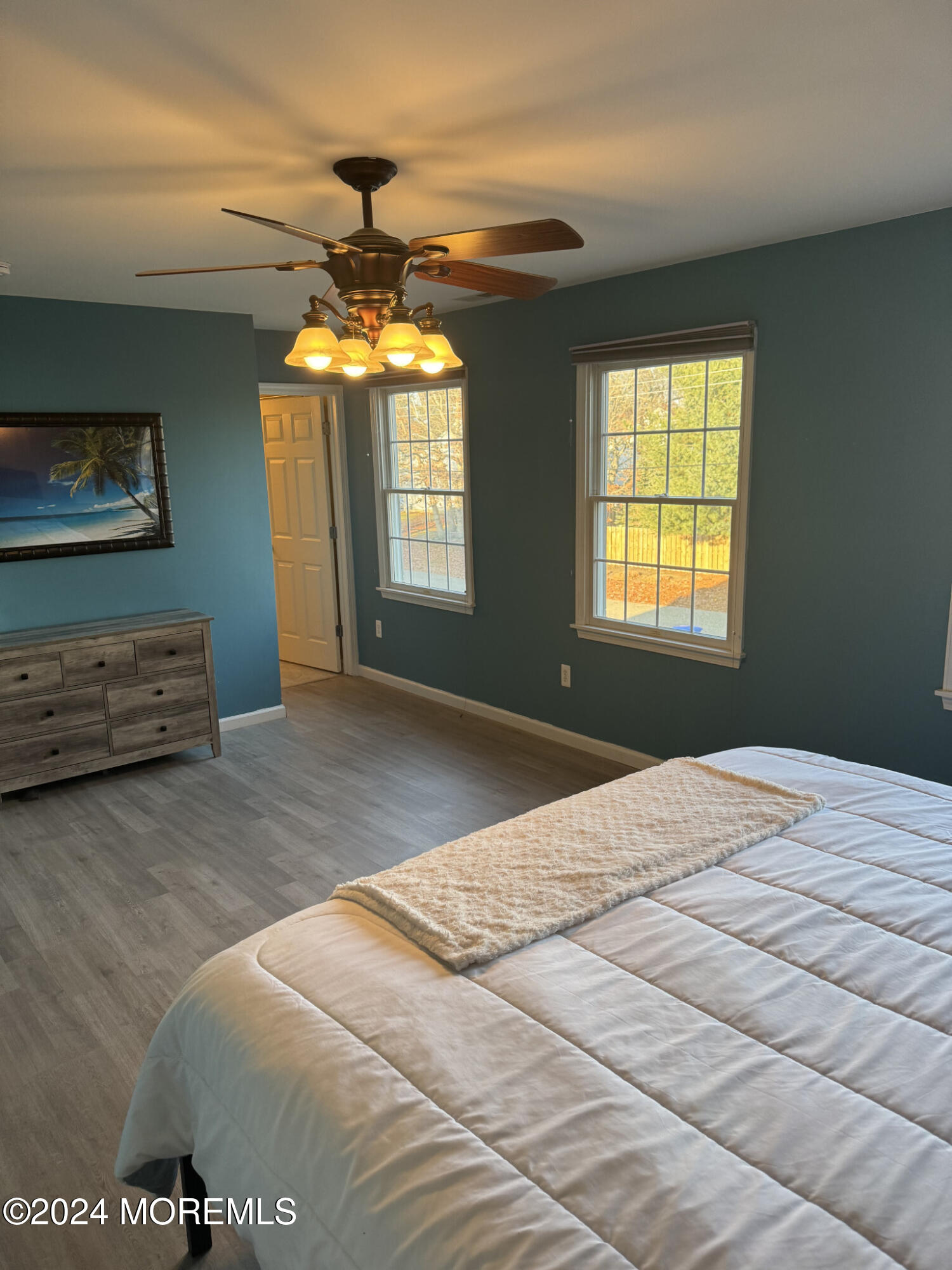 141 Marlin Road Manahawkin, NJ 08050 - Photo 22 of 33 a bedroom with a bed and a chandelier