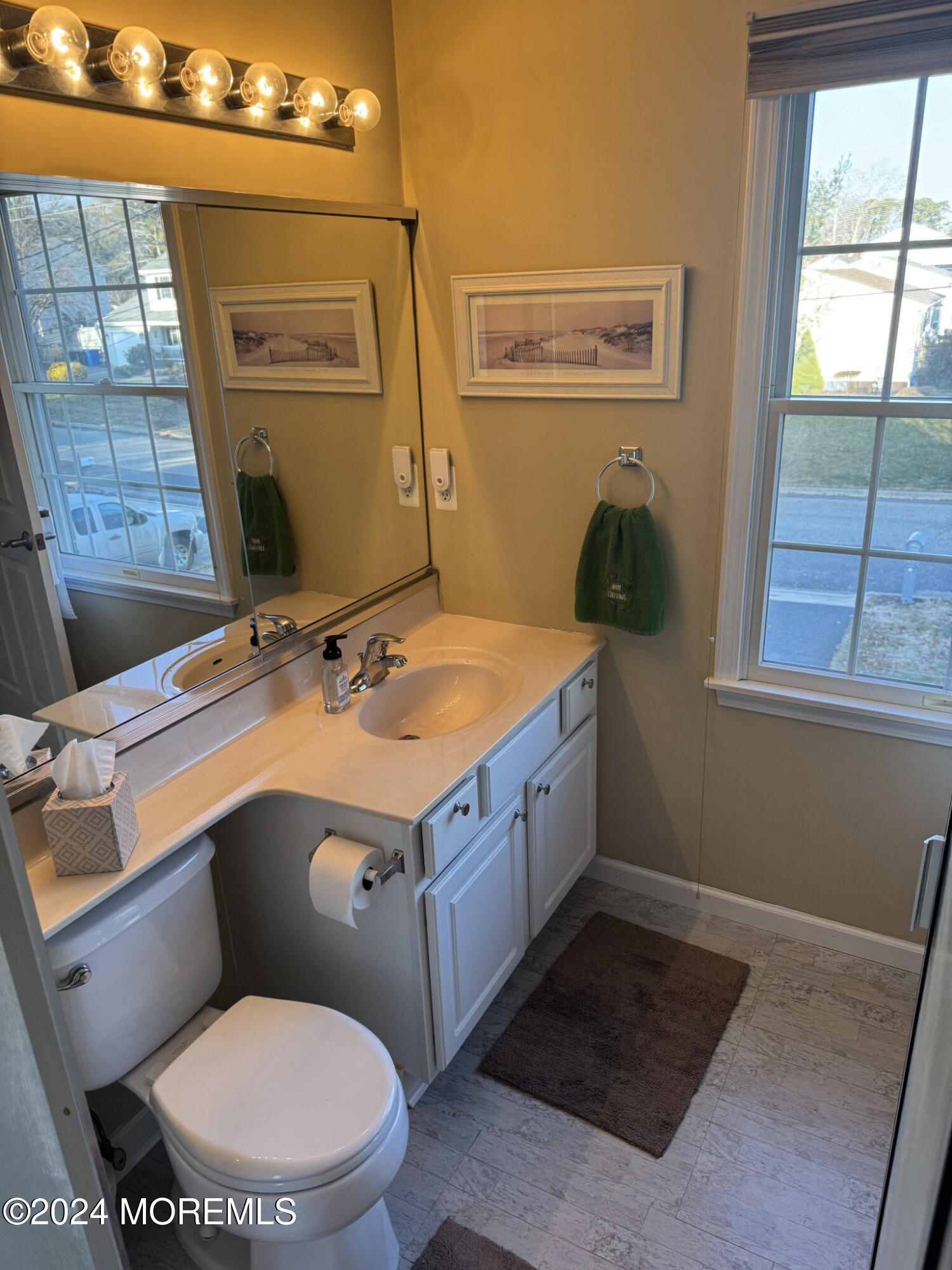 141 Marlin Road Manahawkin, NJ 08050 - Photo 24 of 33 a bathroom with a toilet sink and mirror