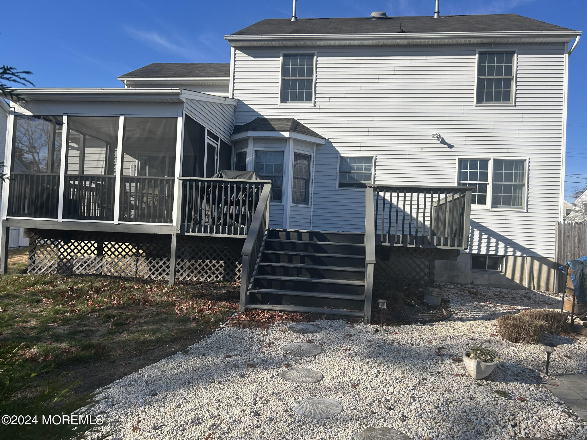 141 Marlin Road Manahawkin, NJ 08050 - Photo 3 of 33 a view of a house with wooden fence
