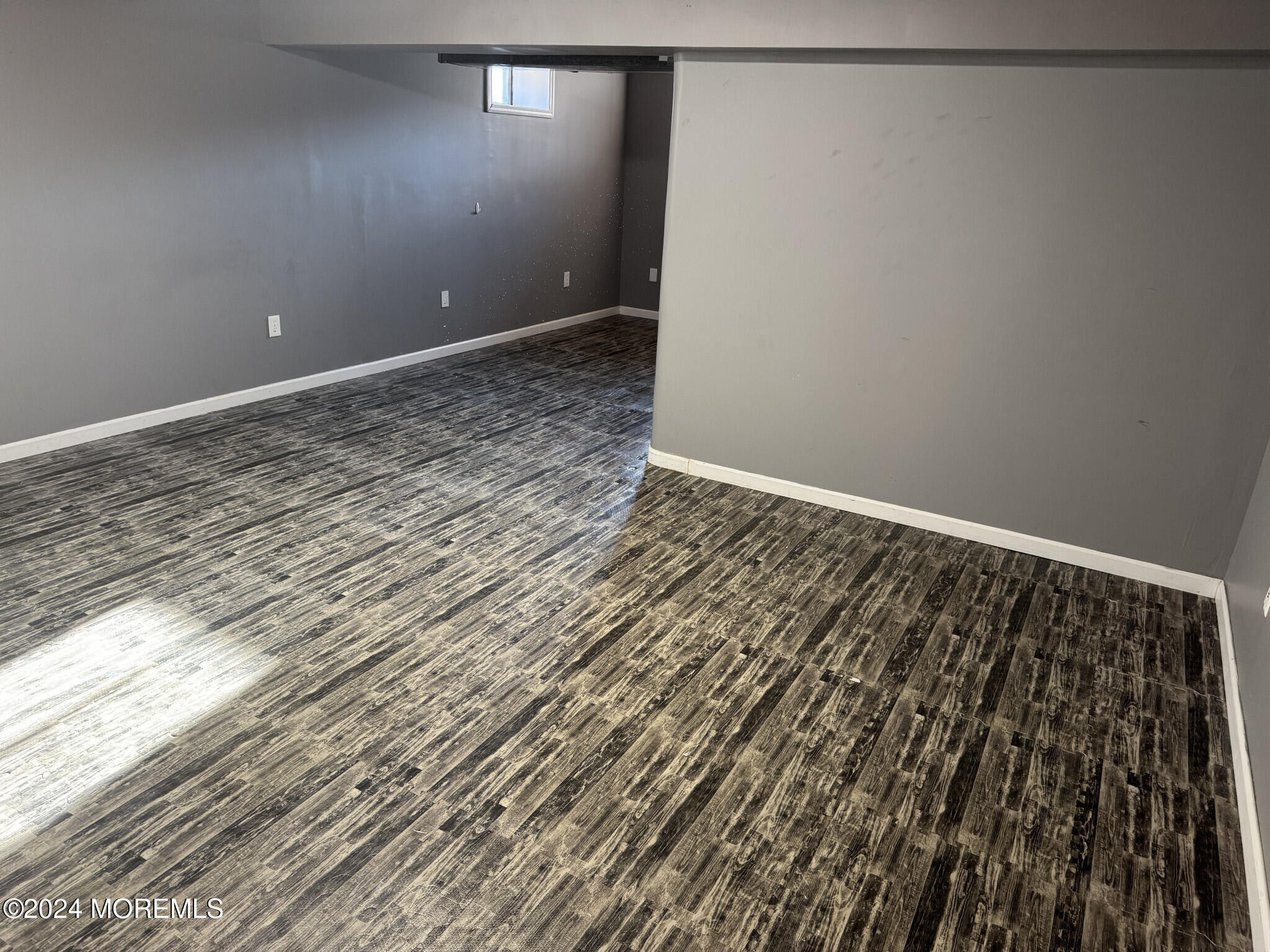 141 Marlin Road Manahawkin, NJ 08050 - Photo 33 of 33 a view of a room with wooden floor and bench