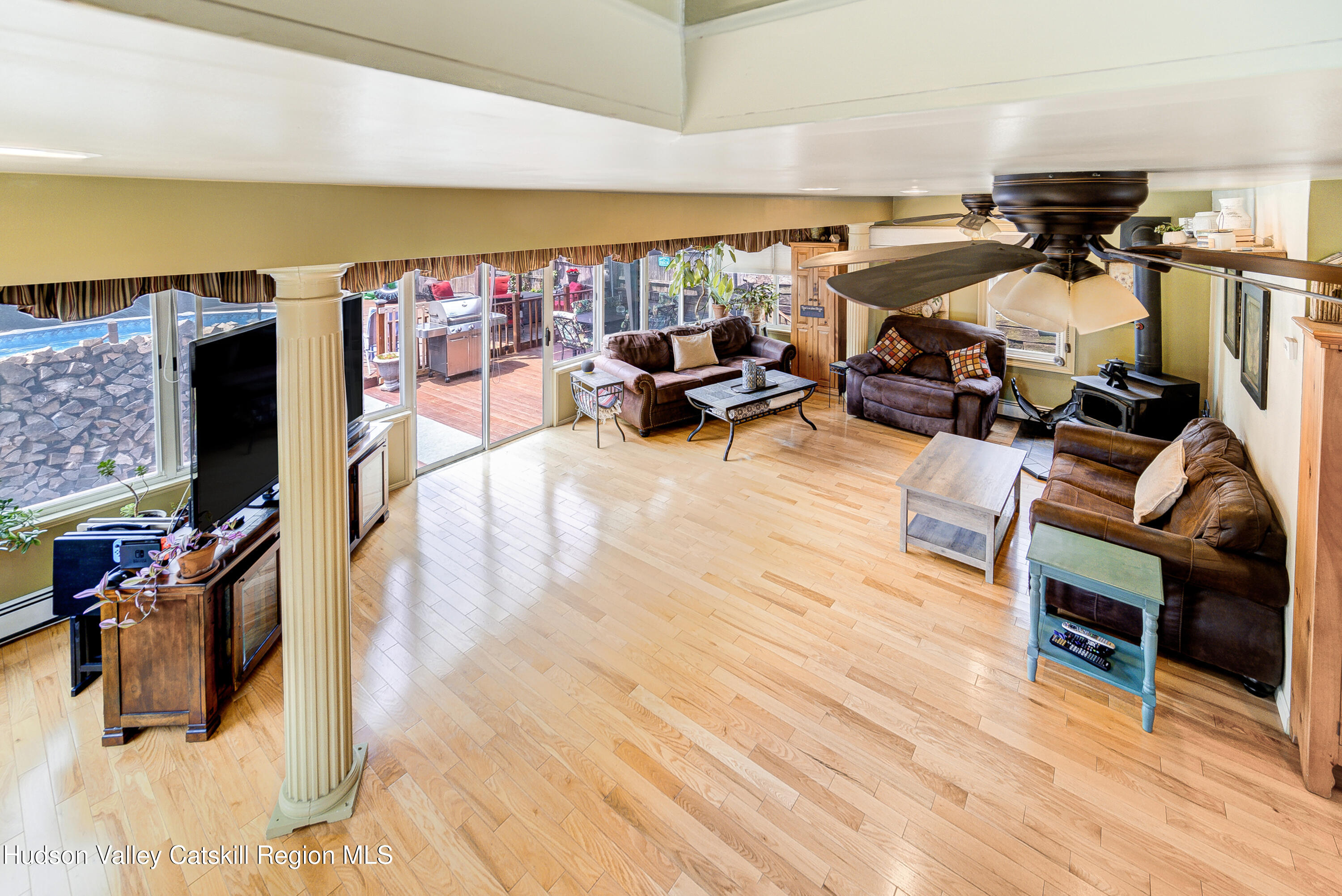2-6 Old Firehouse Road Plattekill, NY 12589 - Photo 20 of 44 a living room with lots of furniture and a flat screen tv