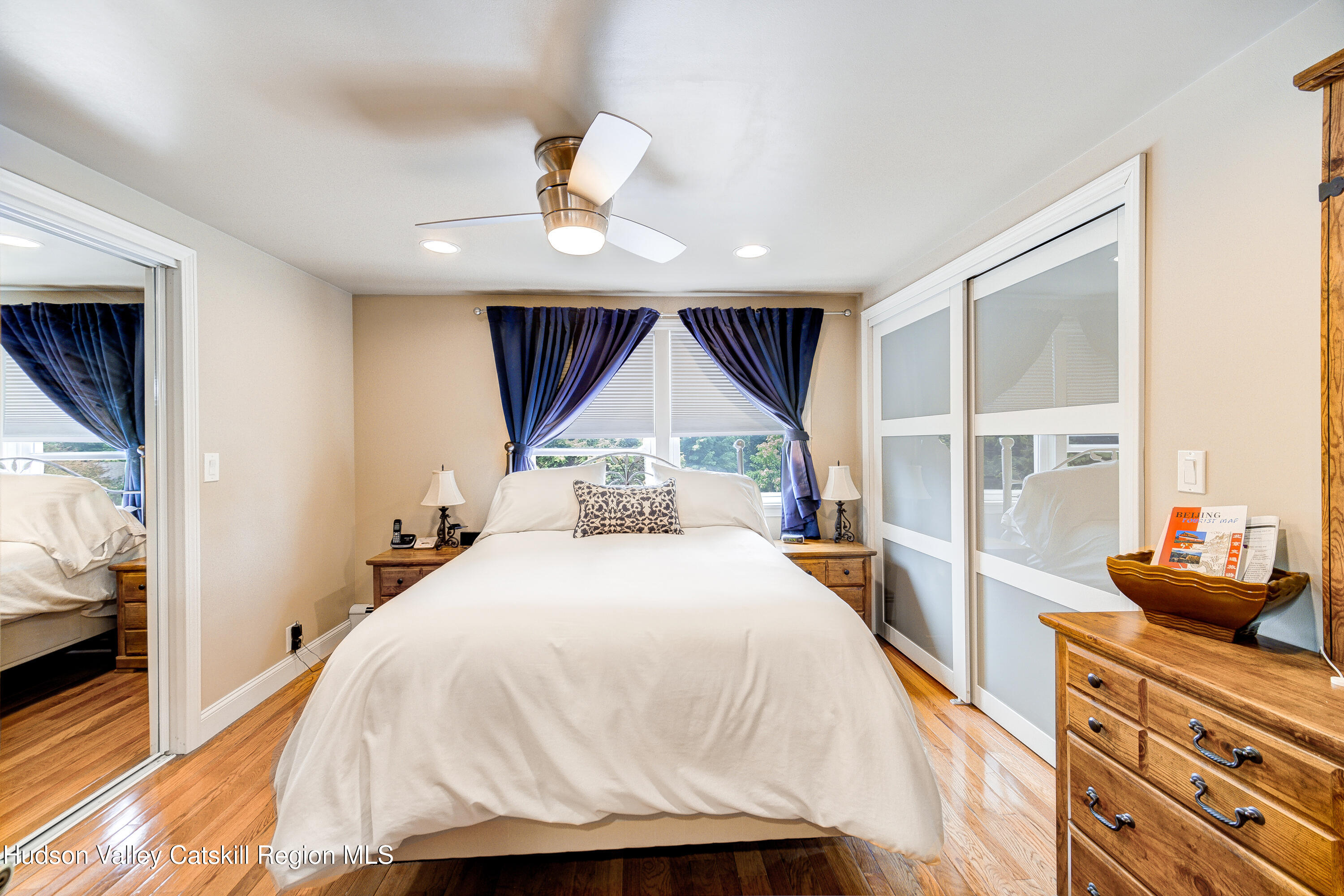 2-6 Old Firehouse Road Plattekill, NY 12589 - Photo 29 of 44 a spacious bedroom with a bed and wooden floor
