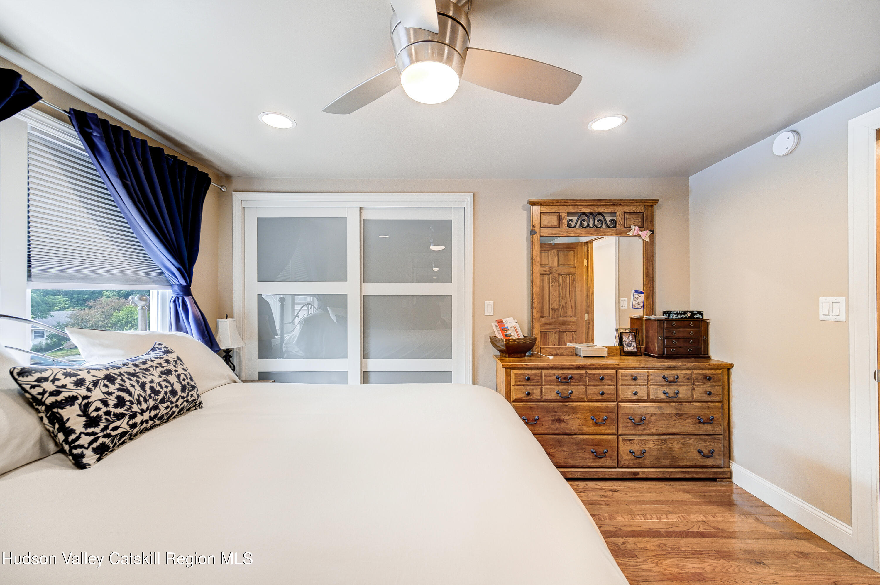 2-6 Old Firehouse Road Plattekill, NY 12589 - Photo 32 of 44 a bedroom with a large bed and a flat tv screen on dresser
