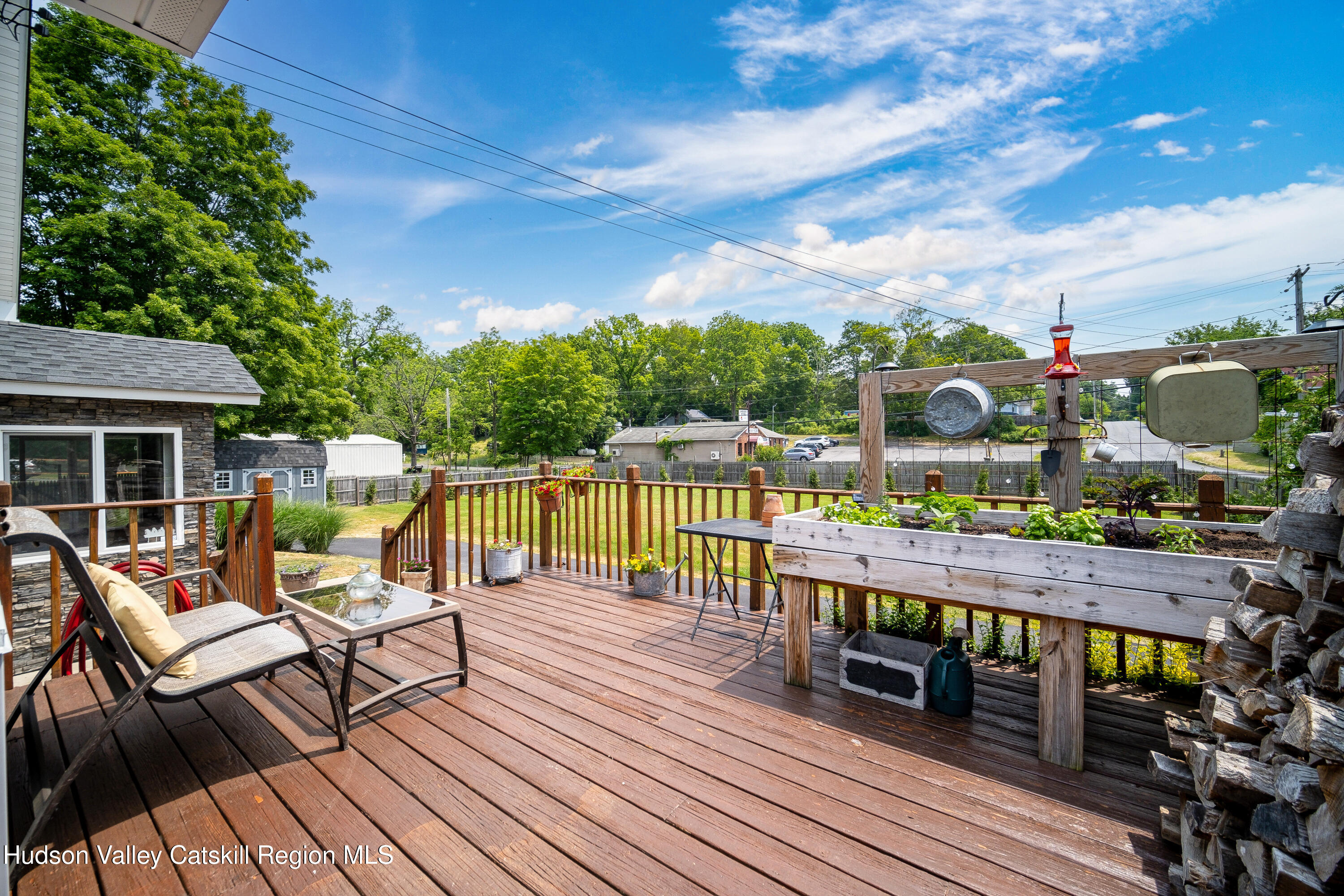 2-6 Old Firehouse Road Plattekill, NY 12589 - Photo 36 of 44 a balcony with wooden floor table and chairs