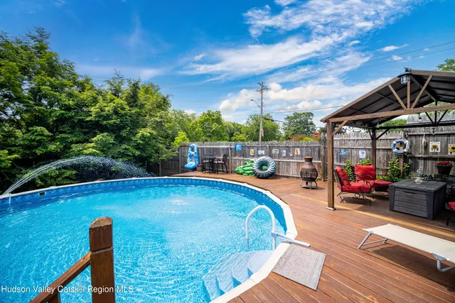 a view of a swimming pool with sitting area