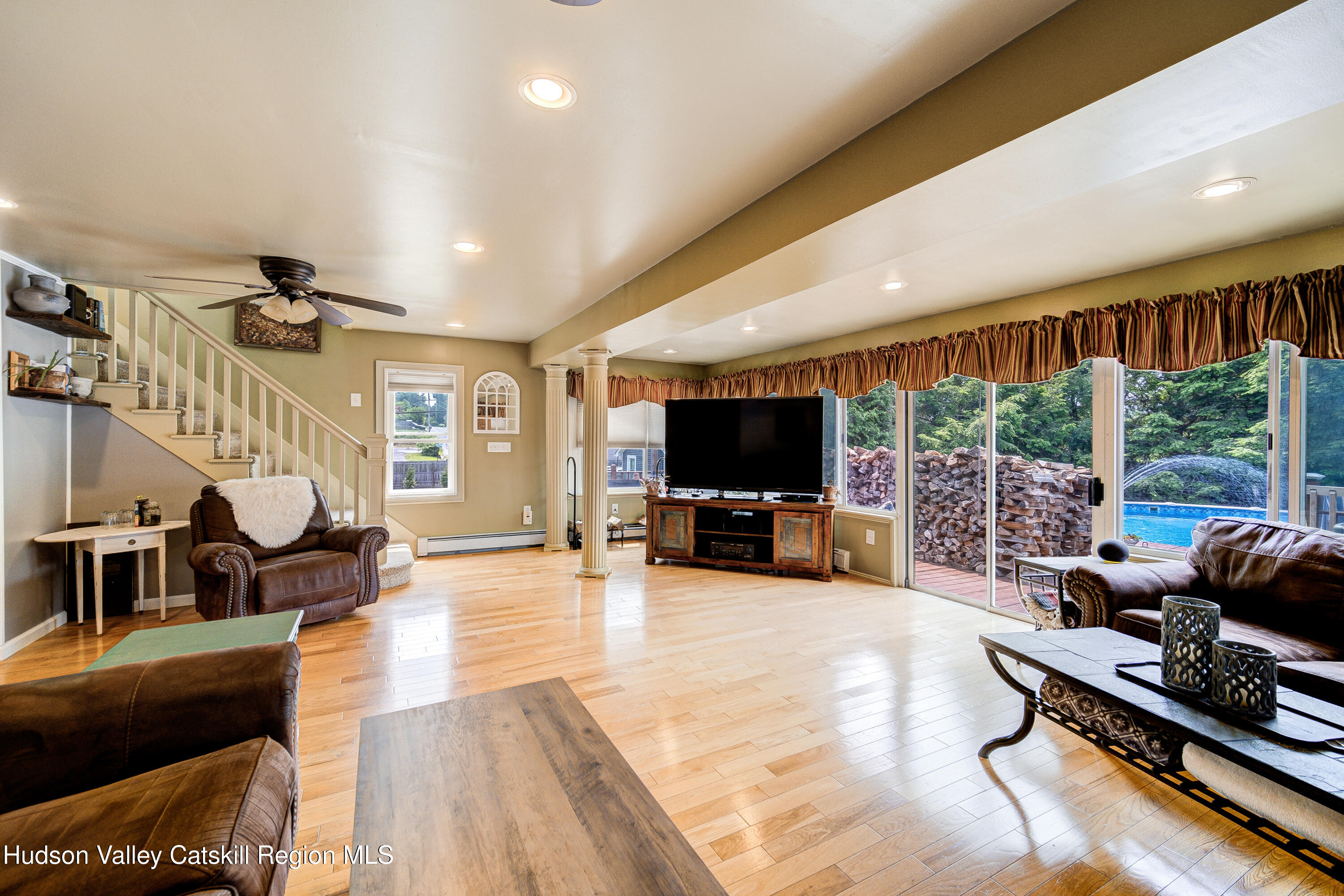 2-6 Old Firehouse Road Plattekill, NY 12589 - Photo 10 of 44 a living room with furniture flat screen tv and a large window