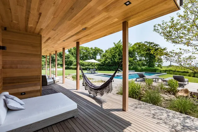 a view of a two chairs in the balcony