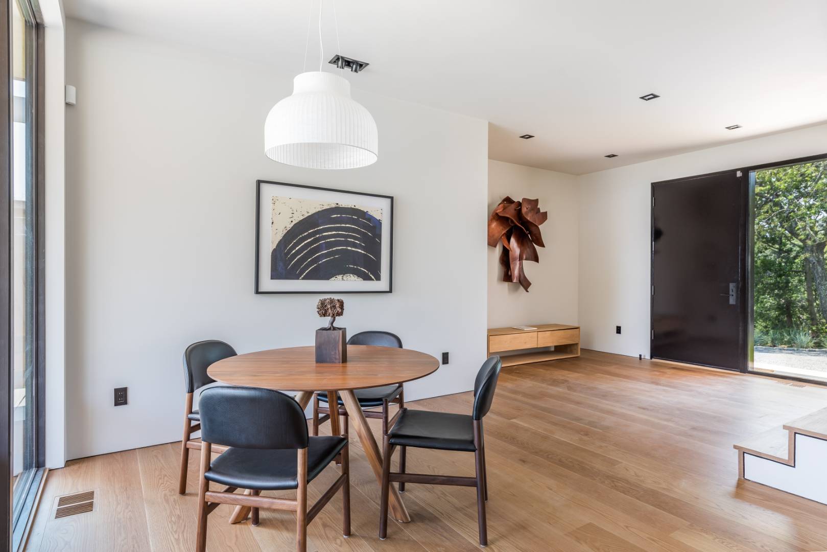 6 Tara Road Montauk, NY 11954 - Photo 3 of 24 a dining room with furniture and wooden floor