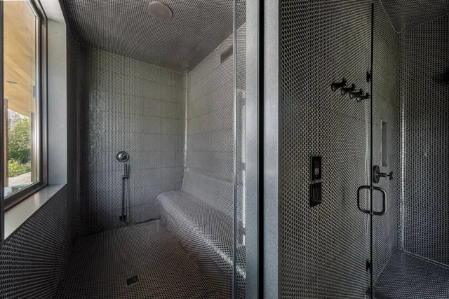 a bathroom with a bathtub and shower