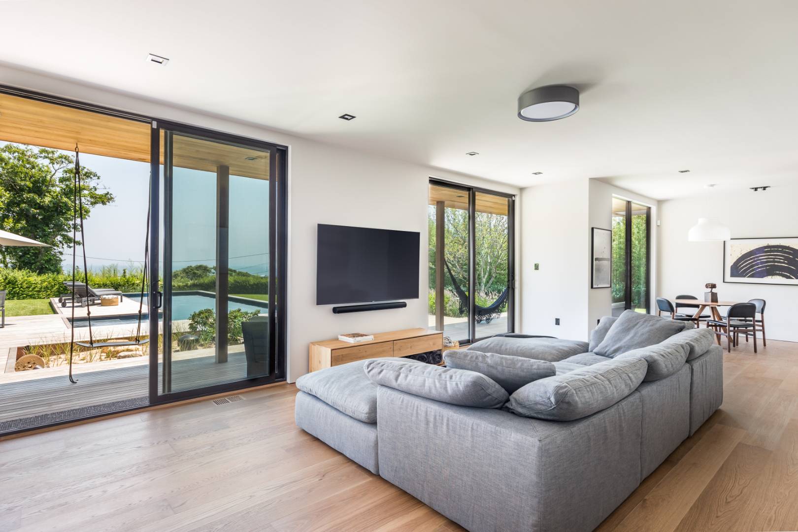 6 Tara Road Montauk, NY 11954 - Photo 9 of 24 a living room with furniture and a flat screen tv