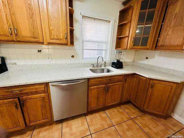 a kitchen with stainless steel appliances granite countertop sink and cabinets