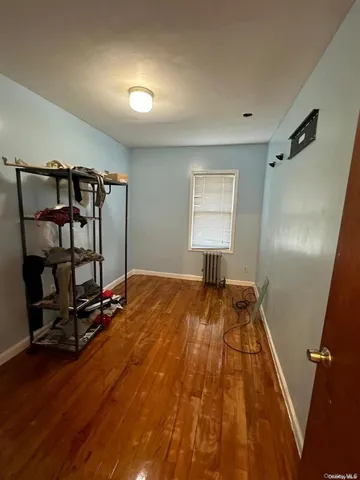 a bed room with a bed and a window