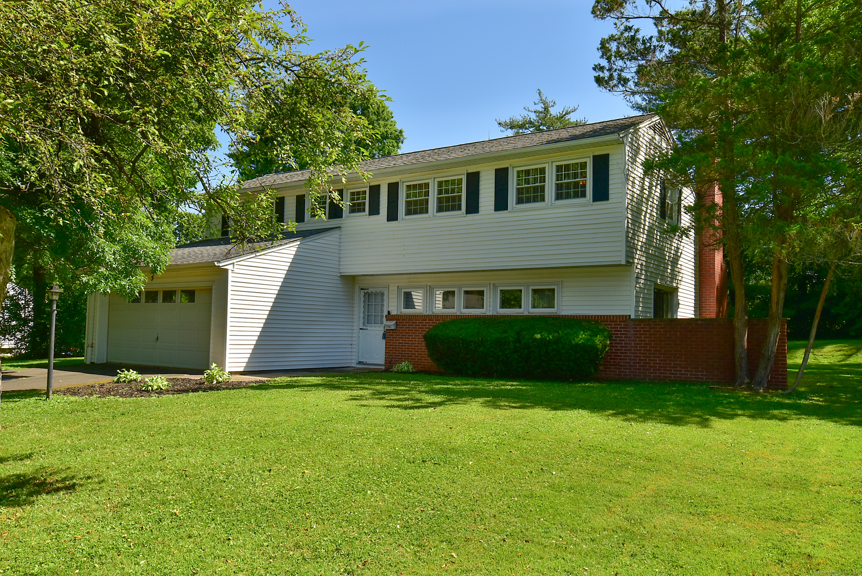a view of house with a big yard