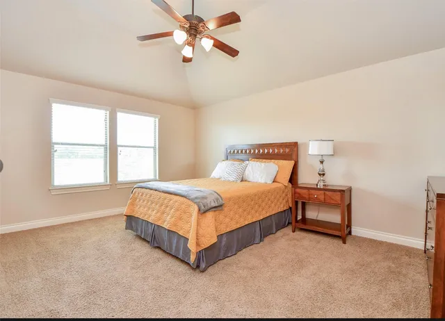 a white toilet sitting next to a white tub