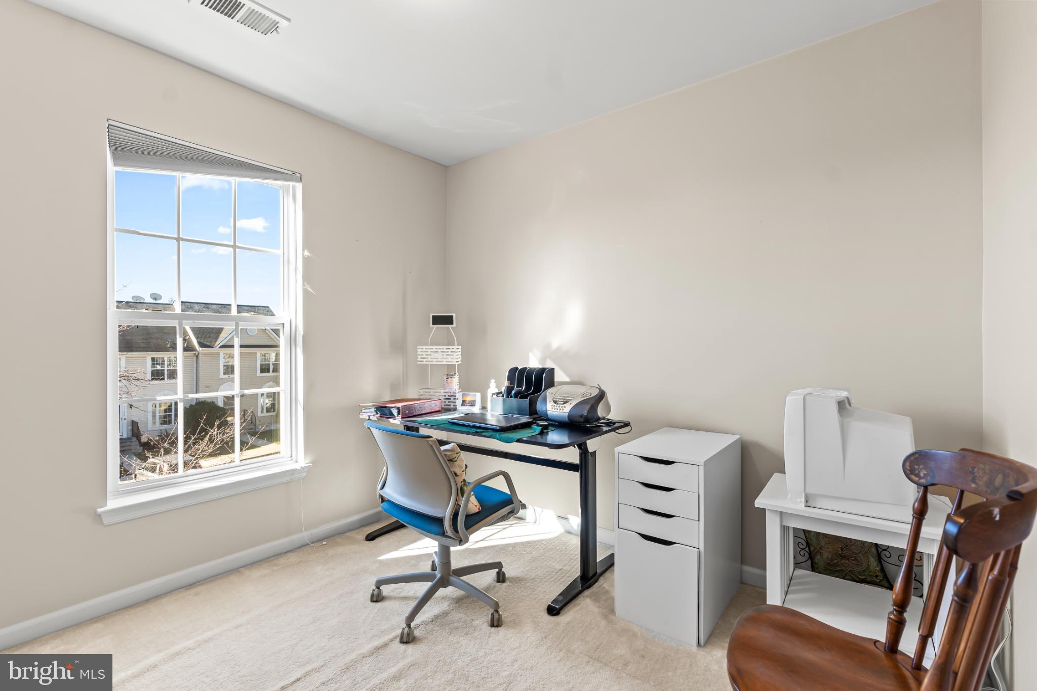 17656 Potter Bell Way Hagerstown, MD 21740 - Photo 23 of 35 a view of a workspace with furniture and a window