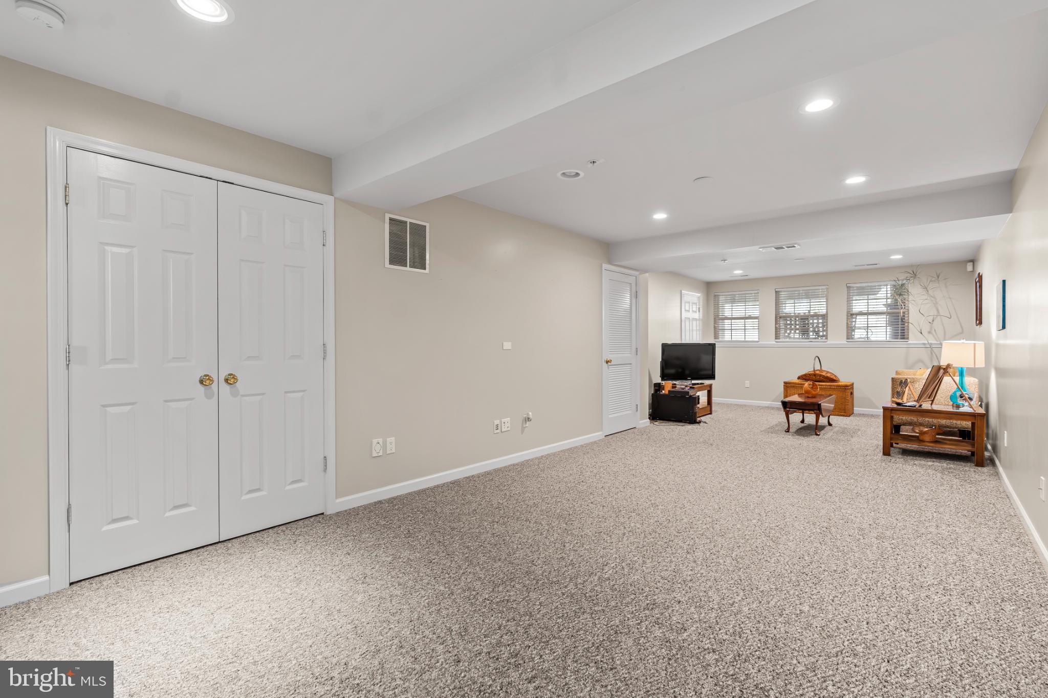 17656 Potter Bell Way Hagerstown, MD 21740 - Photo 27 of 35 a living room with furniture and a car parked in it