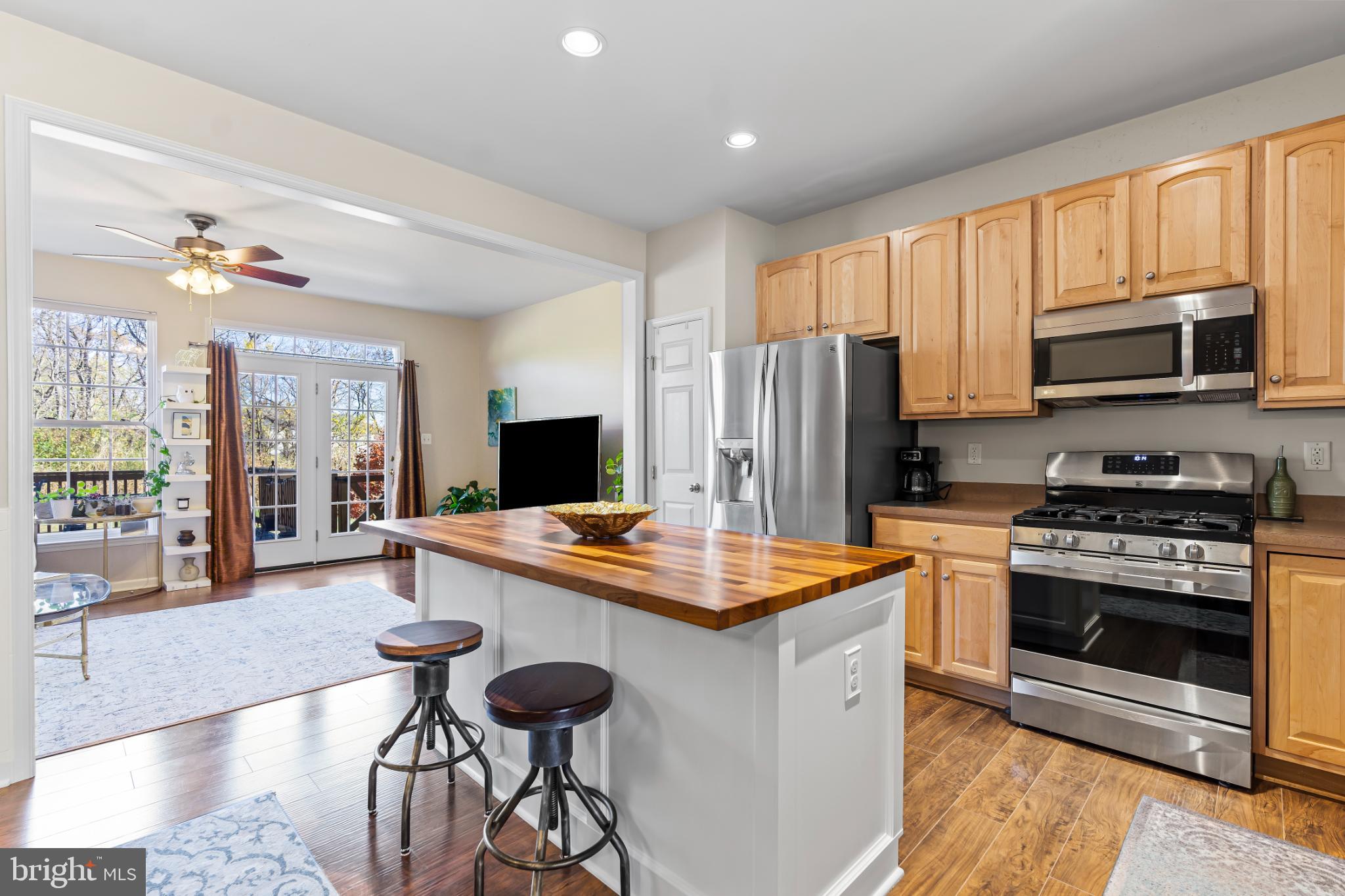 17656 Potter Bell Way Hagerstown, MD 21740 - Photo 5 of 35 a kitchen with stainless steel appliances a stove sink microwave and refrigerator