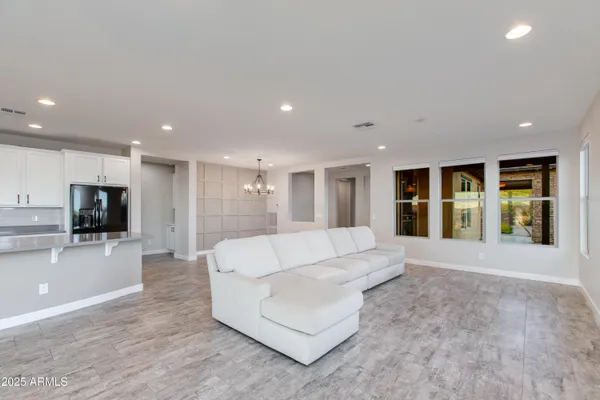a view of a livingroom with a ceiling fan and a window