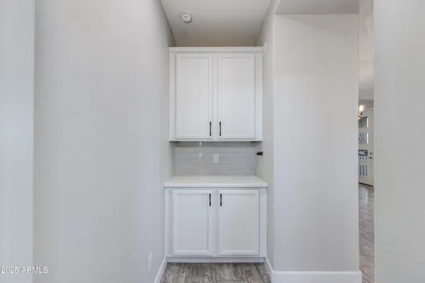 a view of a house with a yard and a fountain