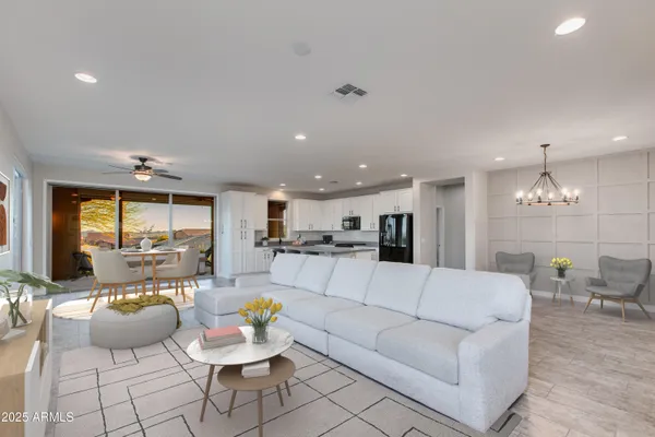 a view of a living room kitchen and a large window