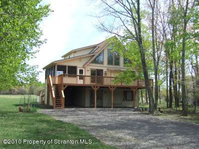 2703 Boulder Road Lake Ariel, PA 18436 - Photo 26 of 26 a front view of a house with a yard