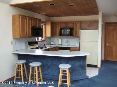 2703 Boulder Road Lake Ariel, PA 18436 - Photo 5 of 26 a kitchen with a sink cabinets and wooden floor