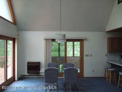 2703 Boulder Road Lake Ariel, PA 18436 - Photo 7 of 26 a view of a livingroom with furniture and windows