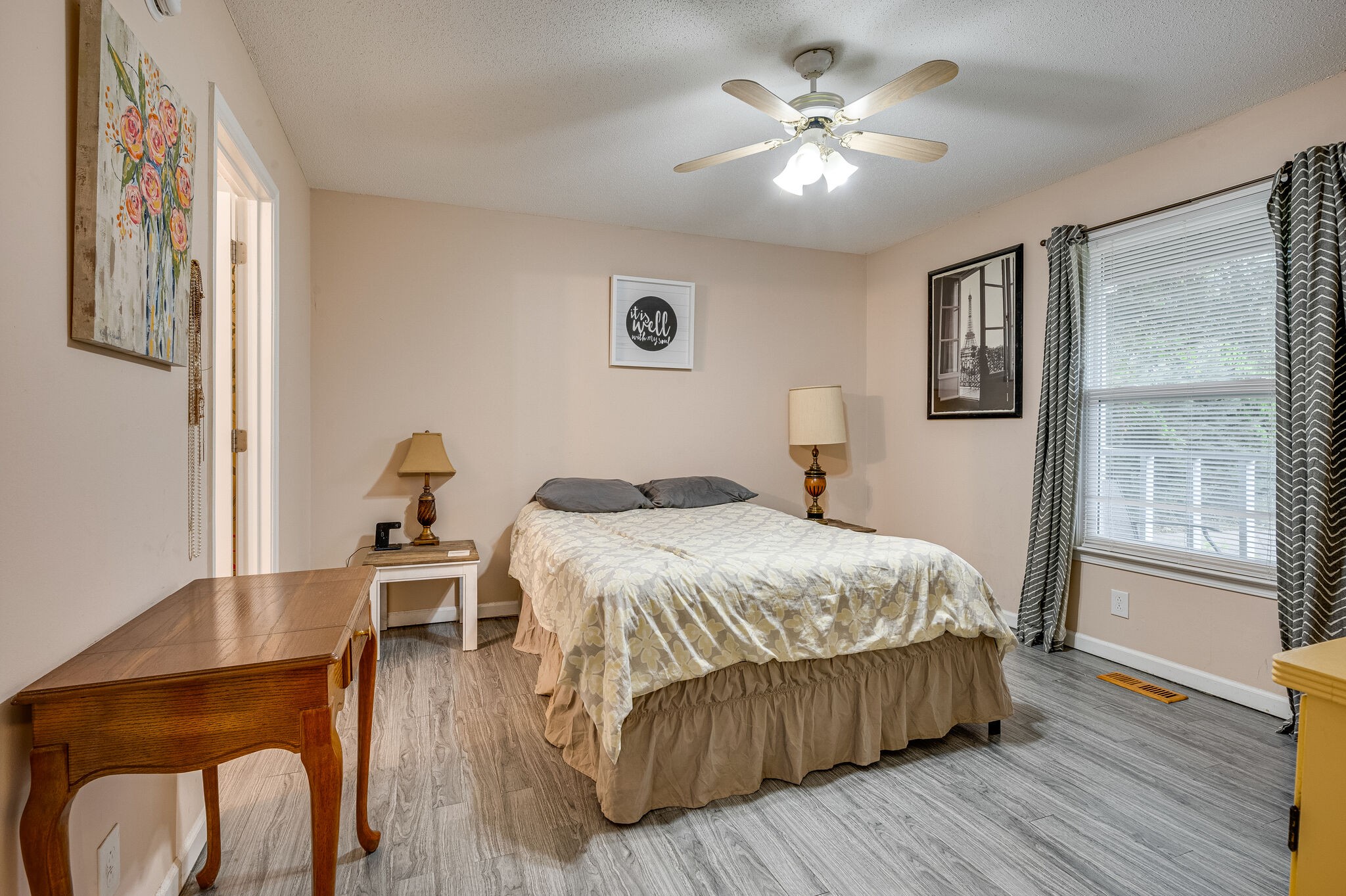 206 Quail Ridge Road Clarksville, TN 37042 - Photo 8 of 14 a bedroom with a bed and a chandelier