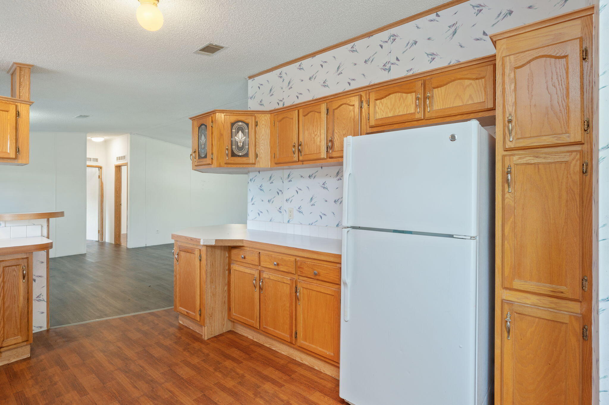 189 Benjamin Street Crestview, FL 32536 - Photo 15 of 40 a white refrigerator freezer sitting in a kitchen