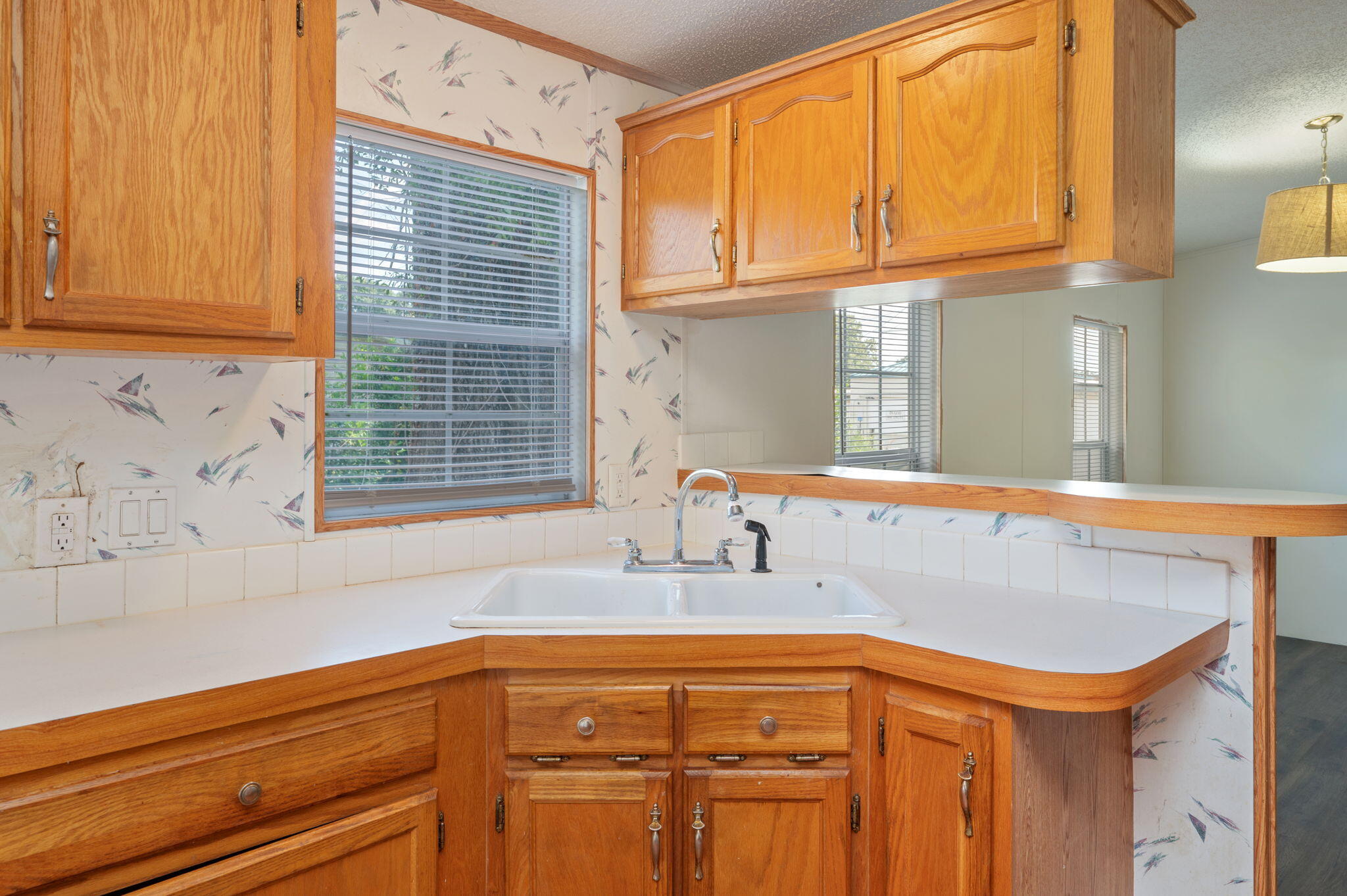 189 Benjamin Street Crestview, FL 32536 - Photo 18 of 40 a bathroom with a sink a mirror and a window