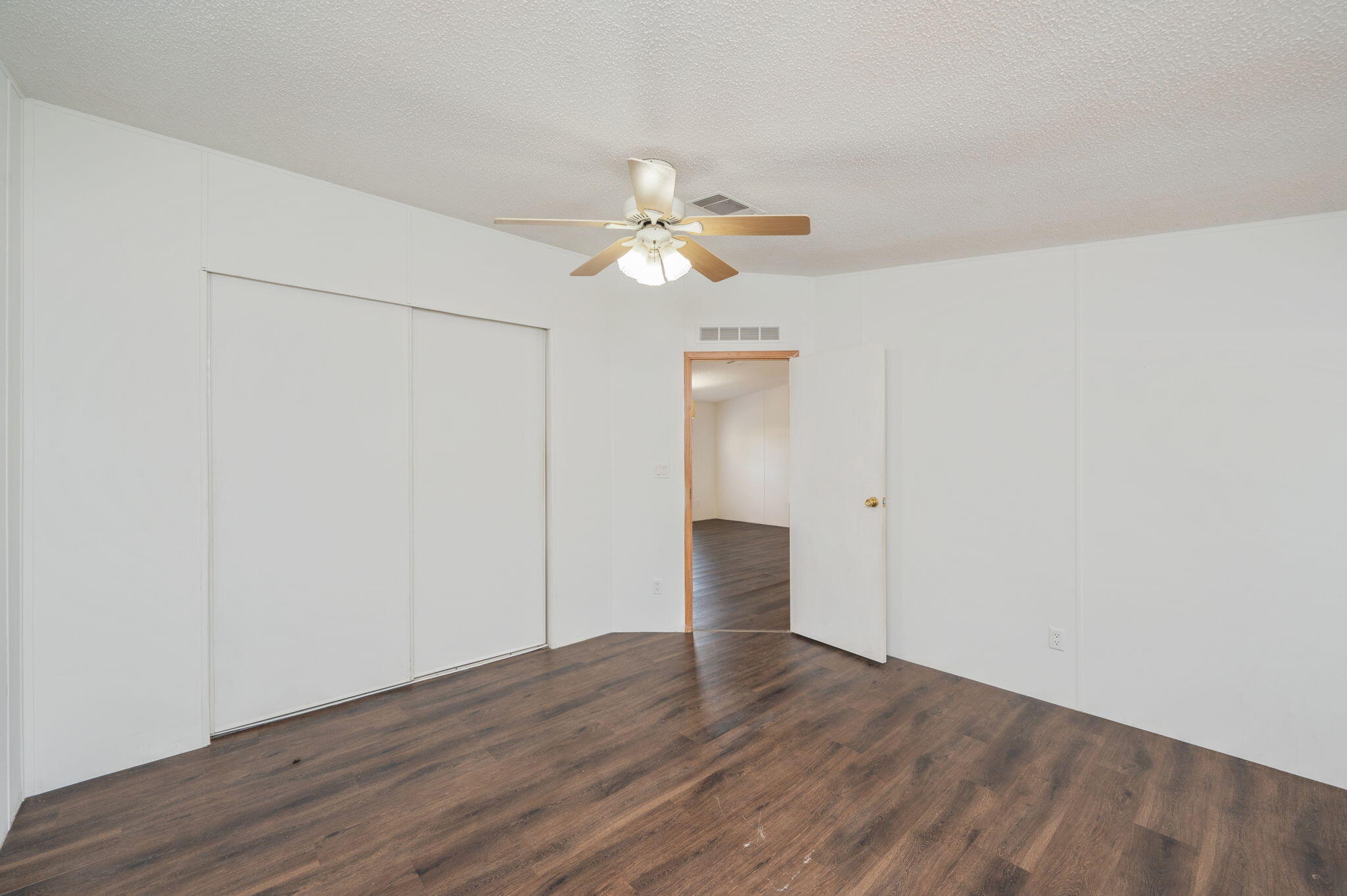 189 Benjamin Street Crestview, FL 32536 - Photo 22 of 40 a view of an empty room and chandelier fan