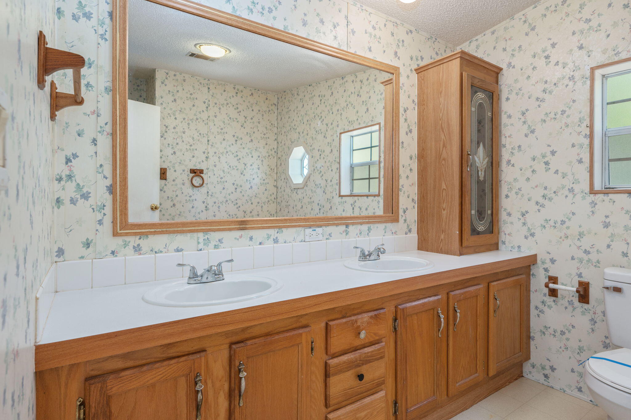 189 Benjamin Street Crestview, FL 32536 - Photo 23 of 40 a bathroom with a sink double vanity and a mirror