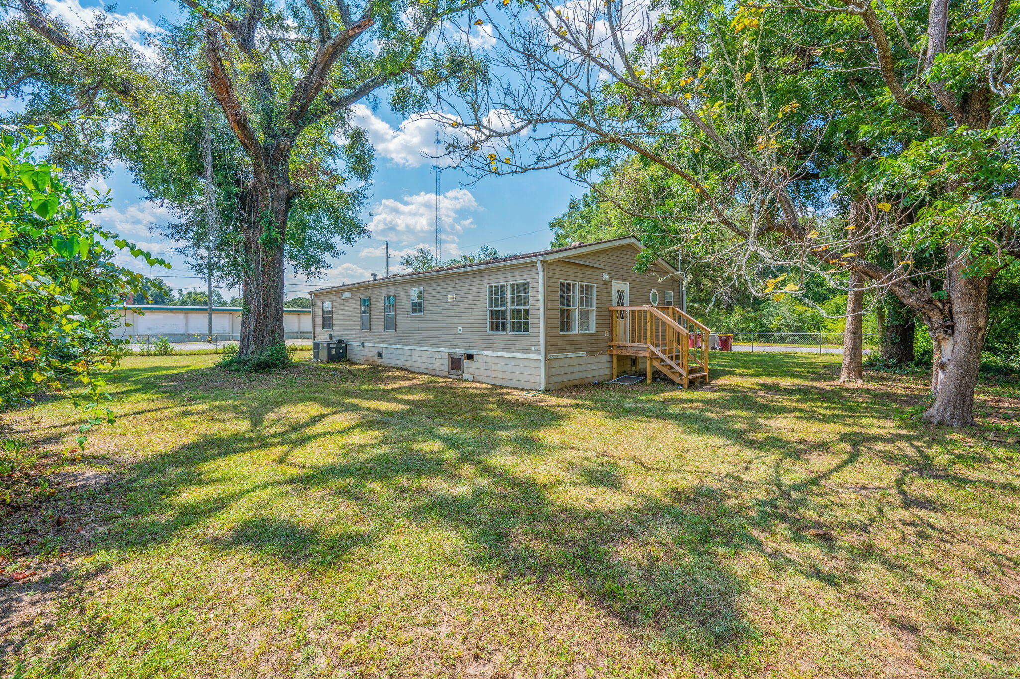 189 Benjamin Street Crestview, FL 32536 - Photo 38 of 40 a view of a house with backyard and tree