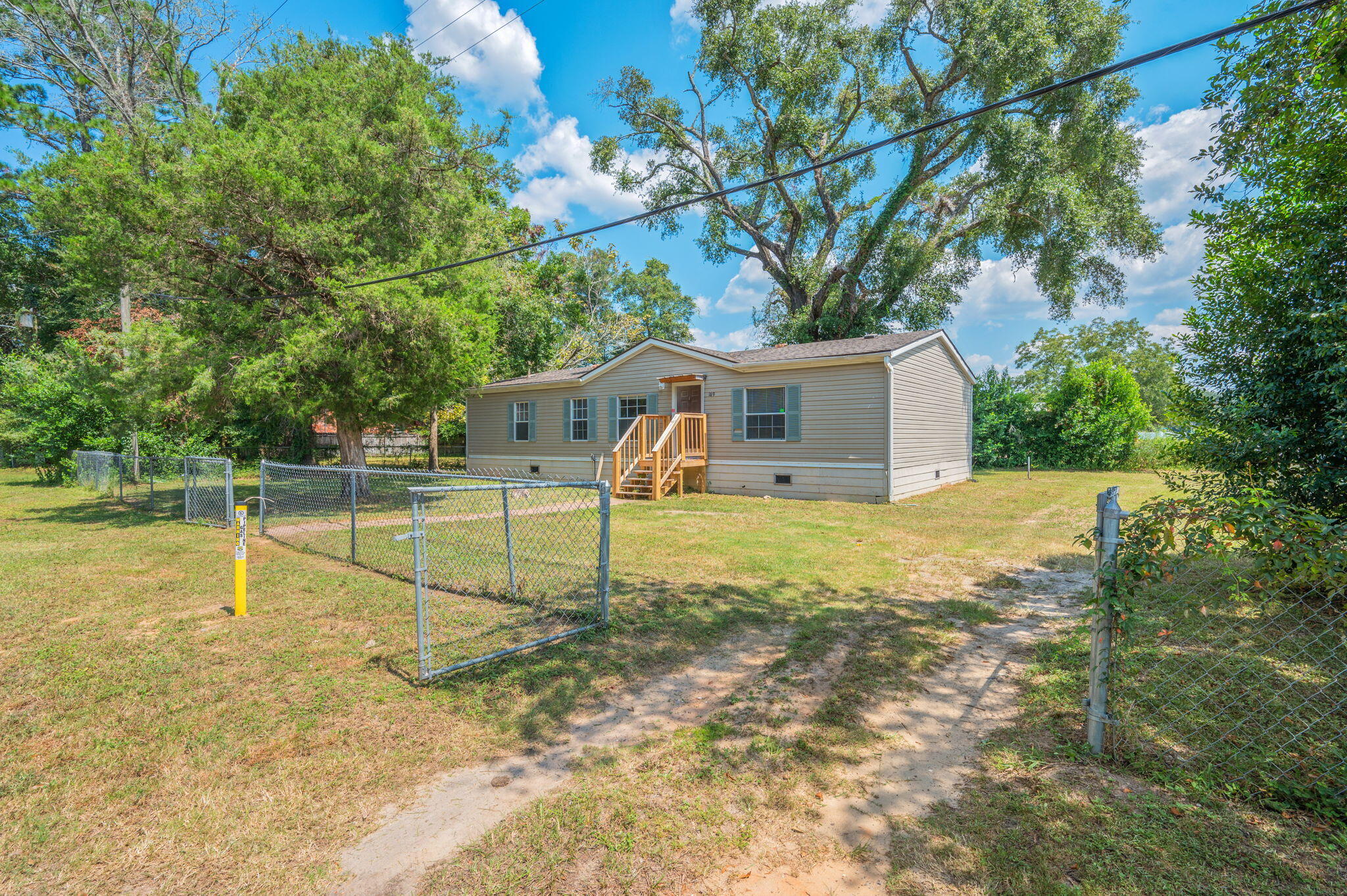 189 Benjamin Street Crestview, FL 32536 - Photo 6 of 40 a house view with a backyard space