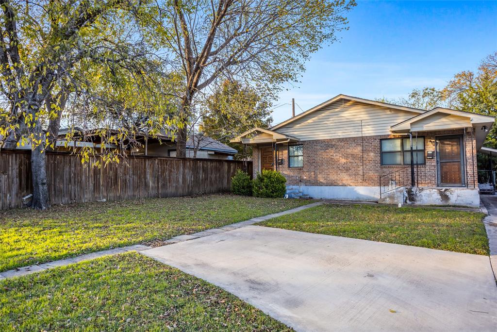 8136 Carlos Street, Unit B White Settlement, TX 76108 - Photo 3 of 17 a front view of a house with a yard and trees