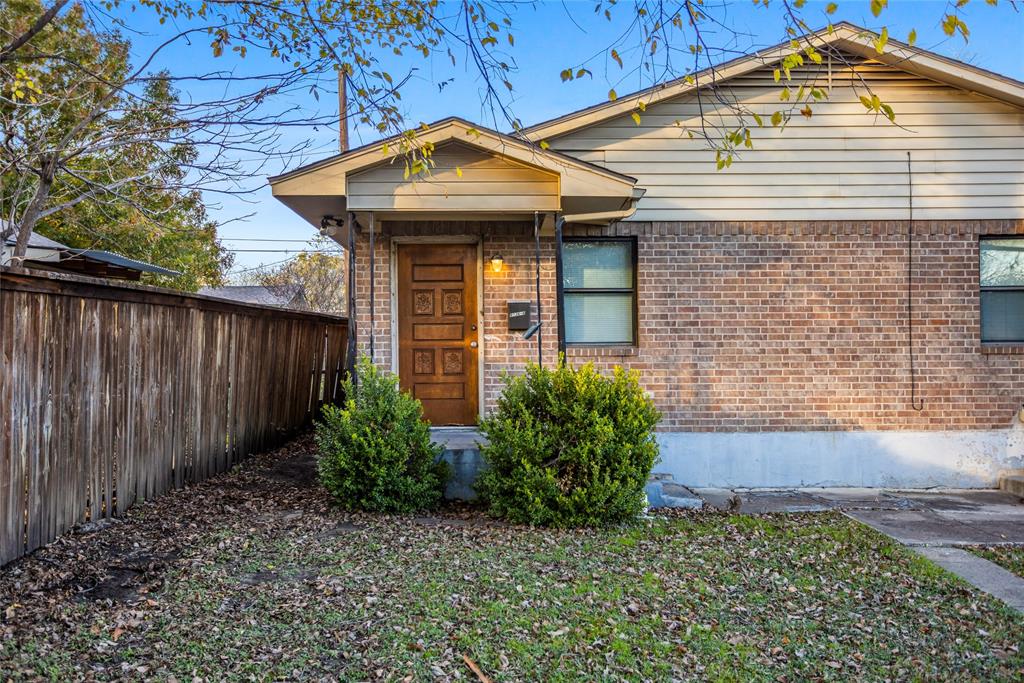 8136 Carlos Street, Unit B White Settlement, TX 76108 - Photo 4 of 17 a front view of a house with garden