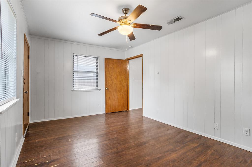8136 Carlos Street, Unit B White Settlement, TX 76108 - Photo 6 of 17 wooden floor in an empty room with a window