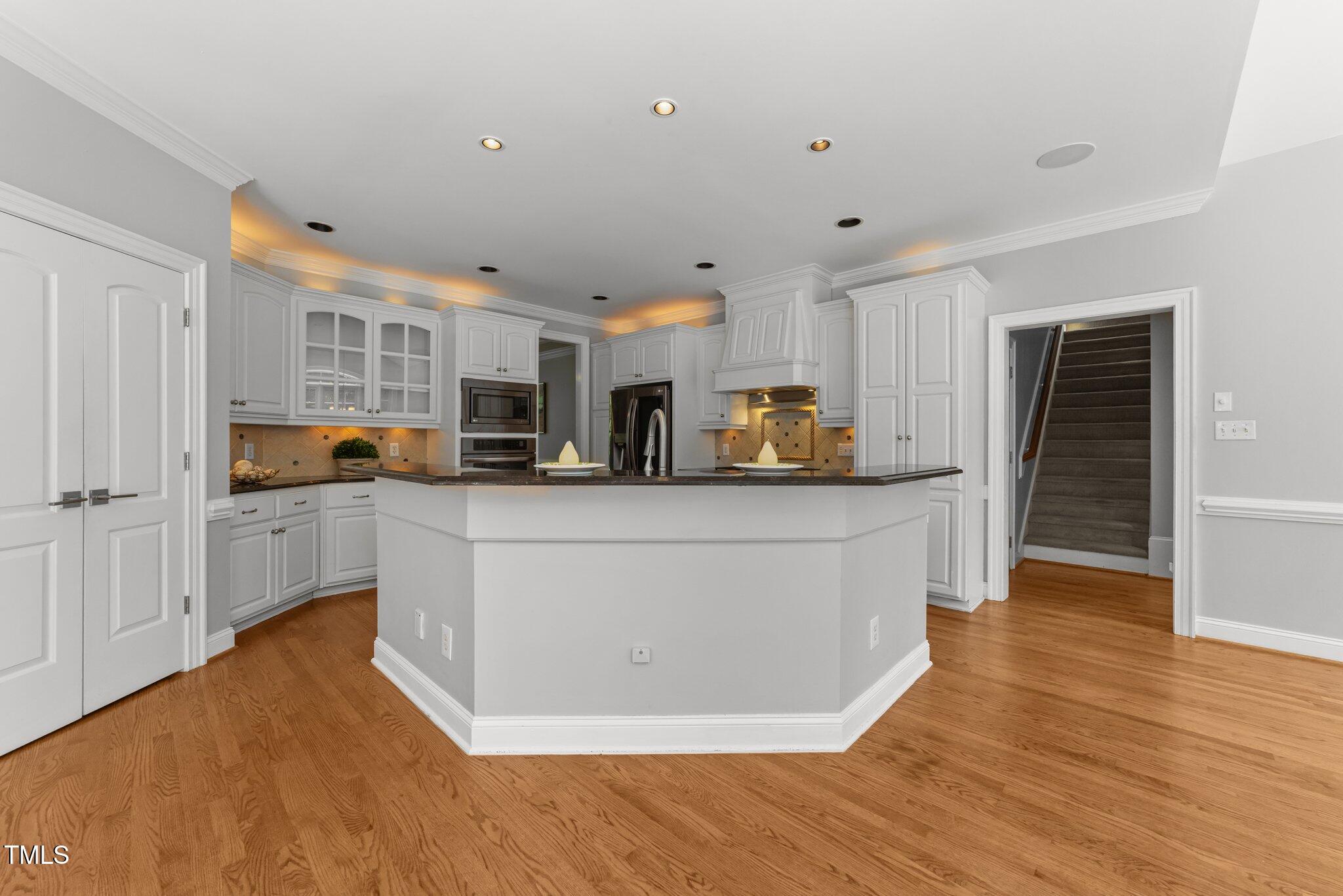7000 Millstone Ridge Court Raleigh, NC 27614 - Photo 12 of 70 a view of kitchen with stainless steel appliances refrigerator oven and cabinets
