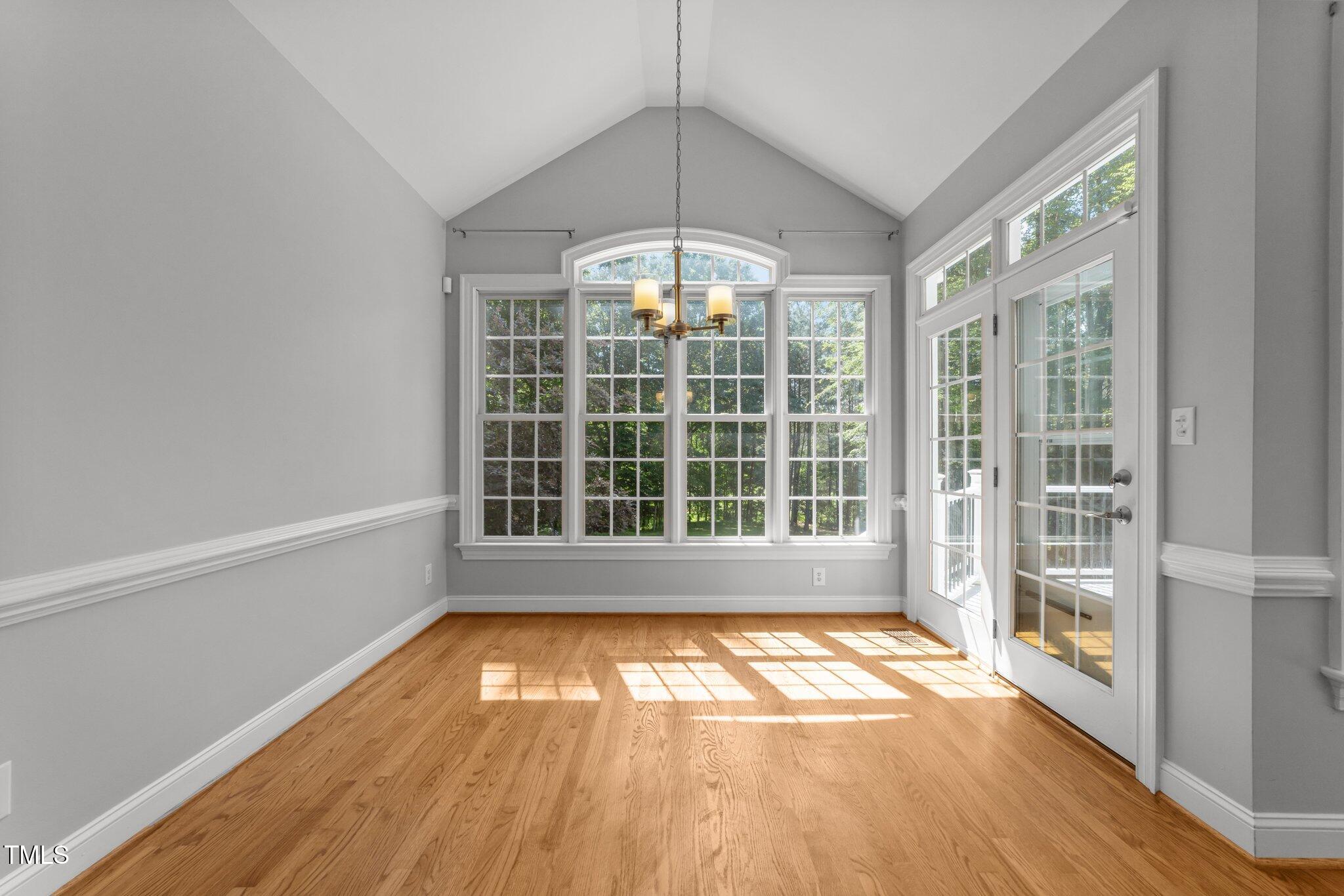 7000 Millstone Ridge Court Raleigh, NC 27614 - Photo 13 of 70 a view of empty room with wooden floor and fan
