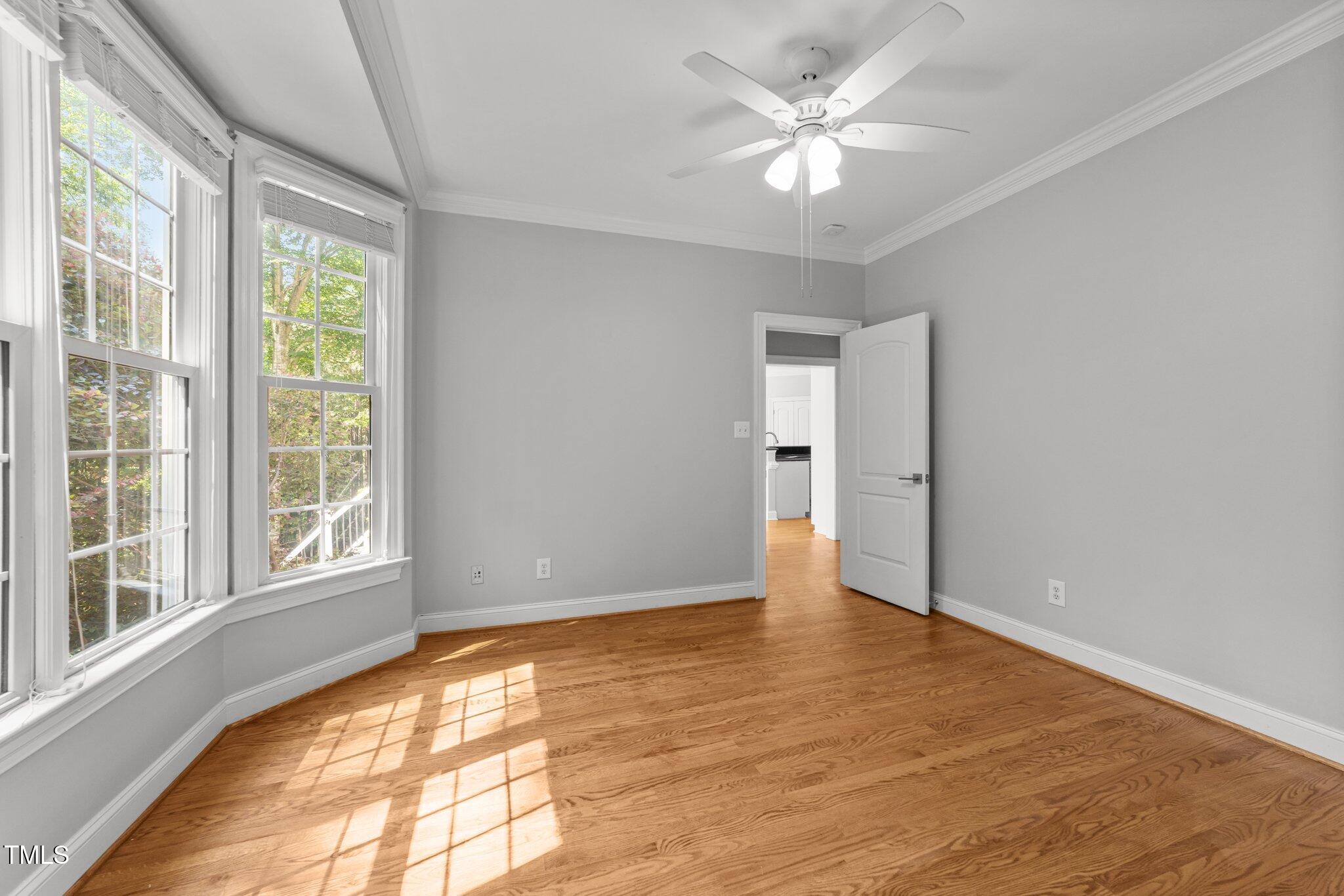 7000 Millstone Ridge Court Raleigh, NC 27614 - Photo 18 of 70 a view of an empty room with window and a chandelier fan