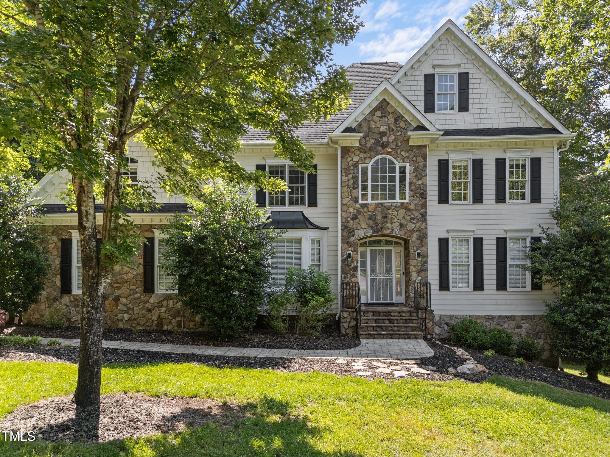 7000 Millstone Ridge Court Raleigh, NC 27614 - Photo 2 of 70 a front view of a house with swimming pool