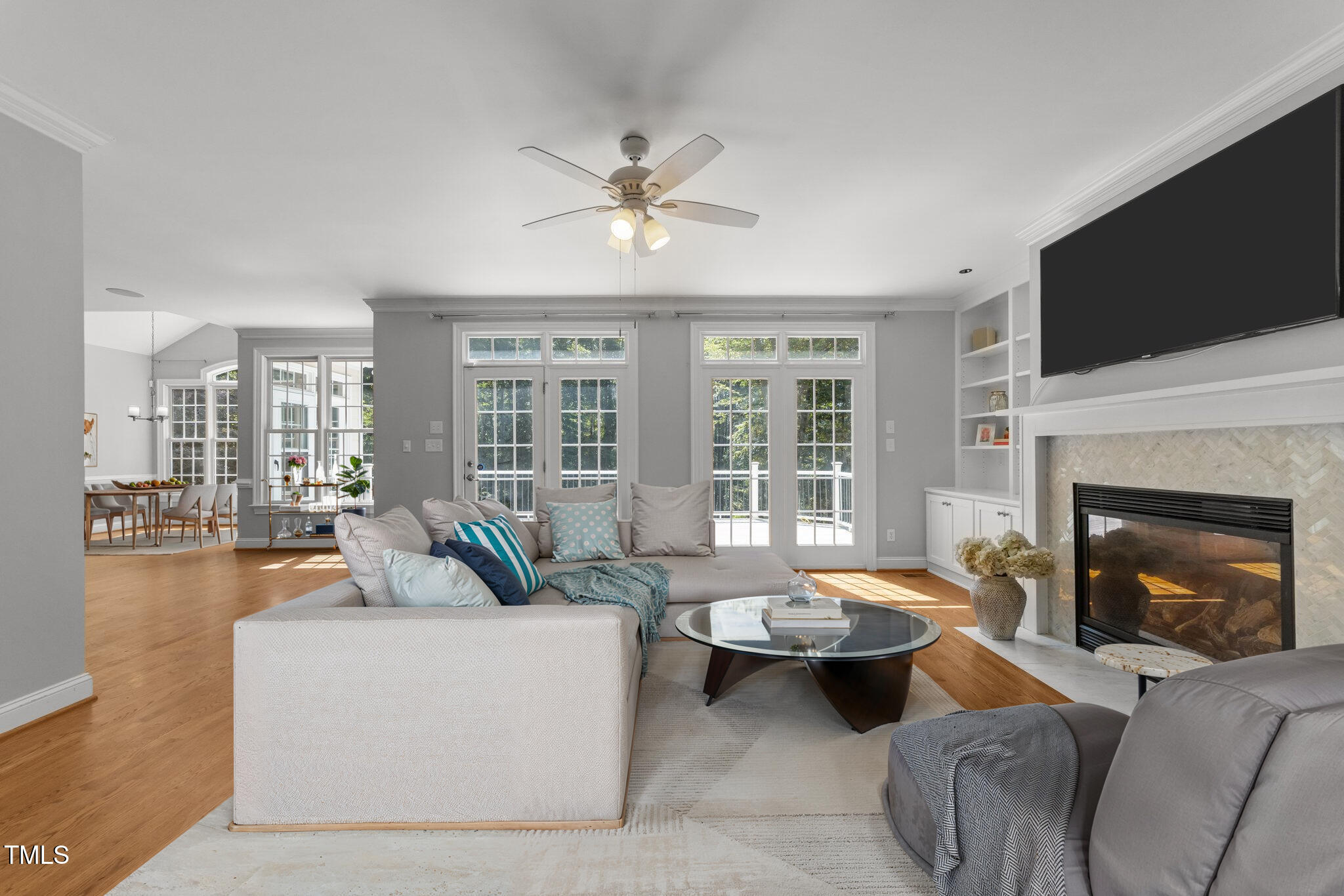 7000 Millstone Ridge Court Raleigh, NC 27614 - Photo 21 of 70 a living room with furniture a fireplace and a flat screen tv