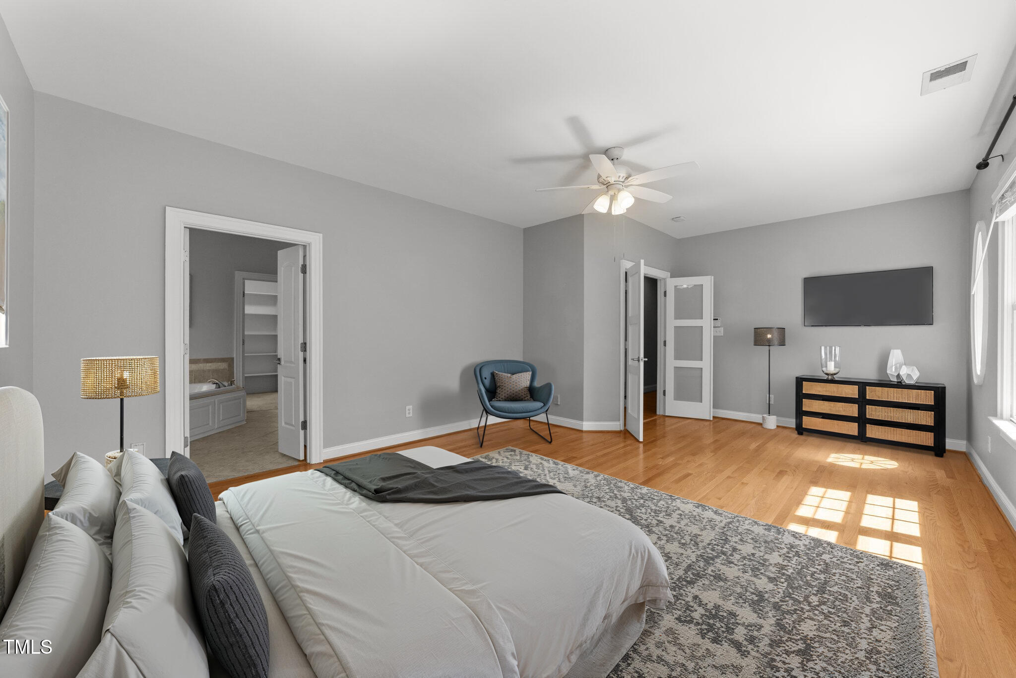 7000 Millstone Ridge Court Raleigh, NC 27614 - Photo 26 of 70 a bedroom with a bed a couch and a chandelier