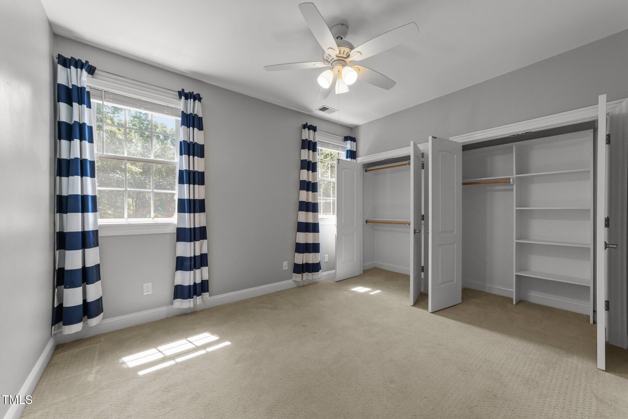 7000 Millstone Ridge Court Raleigh, NC 27614 - Photo 31 of 70 a view of an empty room with a cabinet and a window