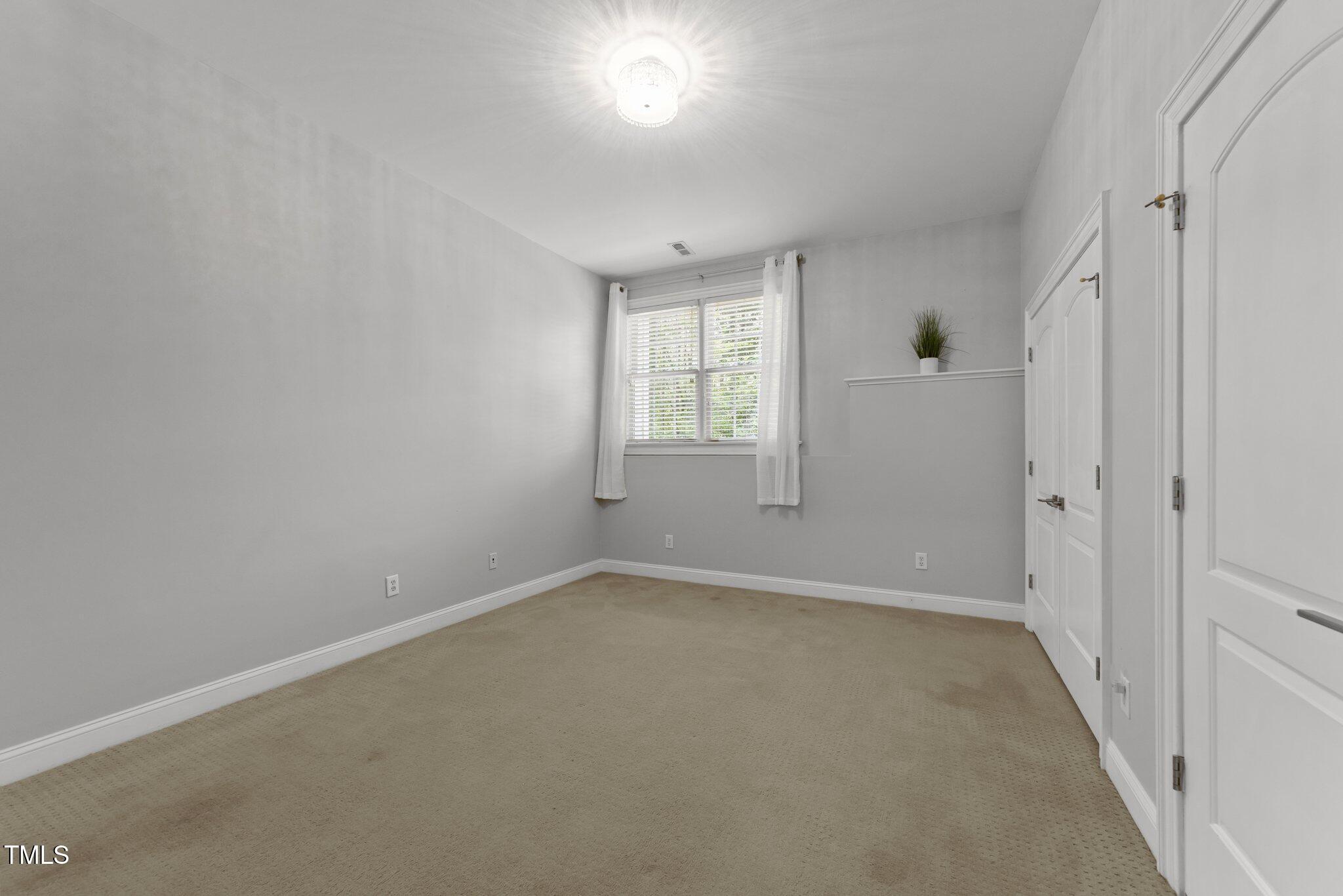 7000 Millstone Ridge Court Raleigh, NC 27614 - Photo 41 of 70 a view of an empty room with a window