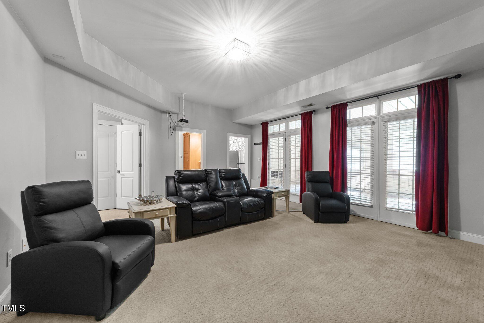 7000 Millstone Ridge Court Raleigh, NC 27614 - Photo 44 of 70 a living room with furniture and a large window