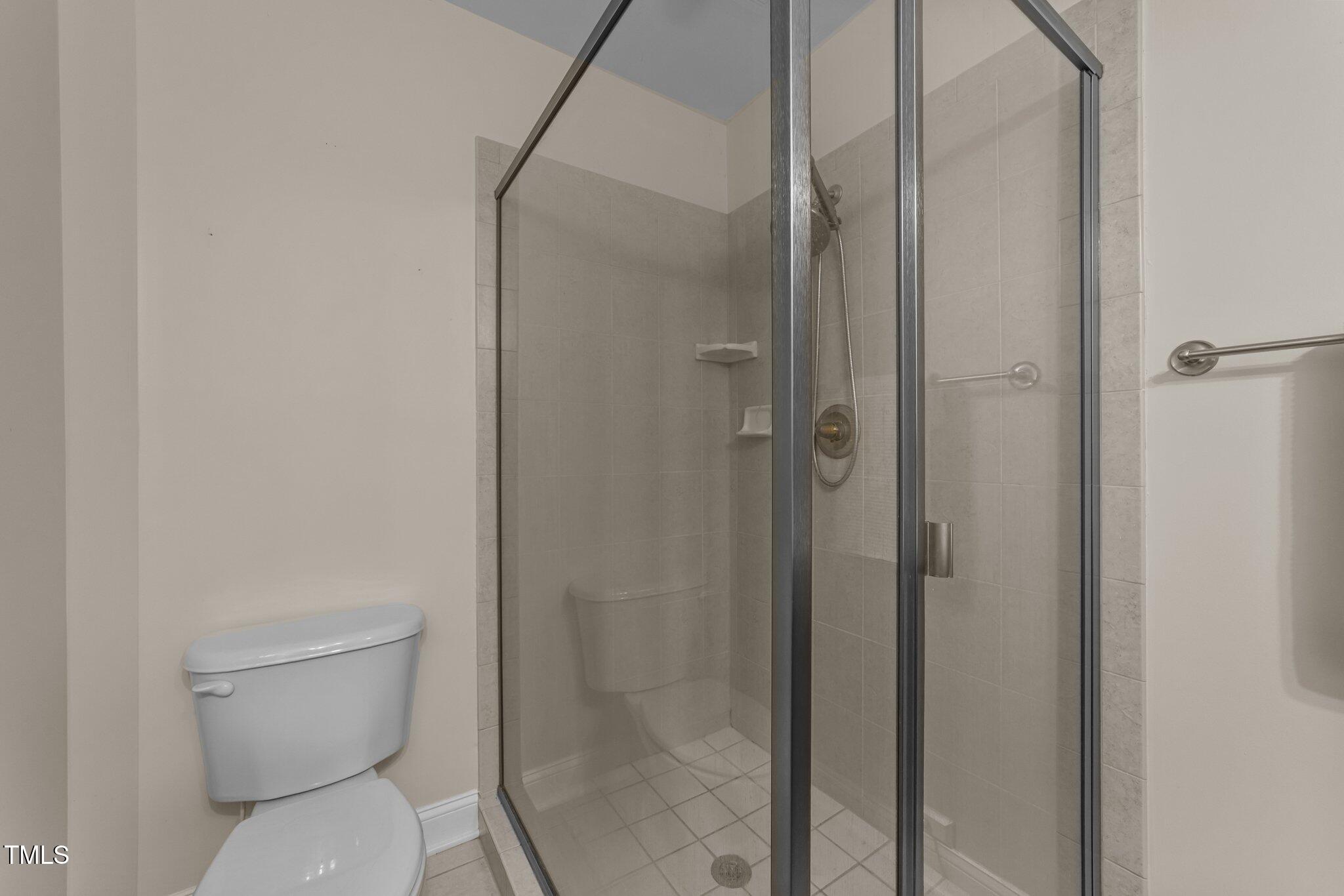 7000 Millstone Ridge Court Raleigh, NC 27614 - Photo 47 of 70 a bathroom with a toilet and a shower