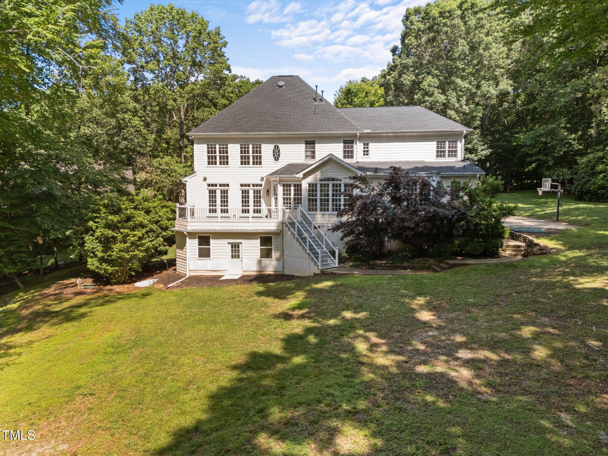 7000 Millstone Ridge Court Raleigh, NC 27614 - Photo 50 of 70 a front view of a house with a yard